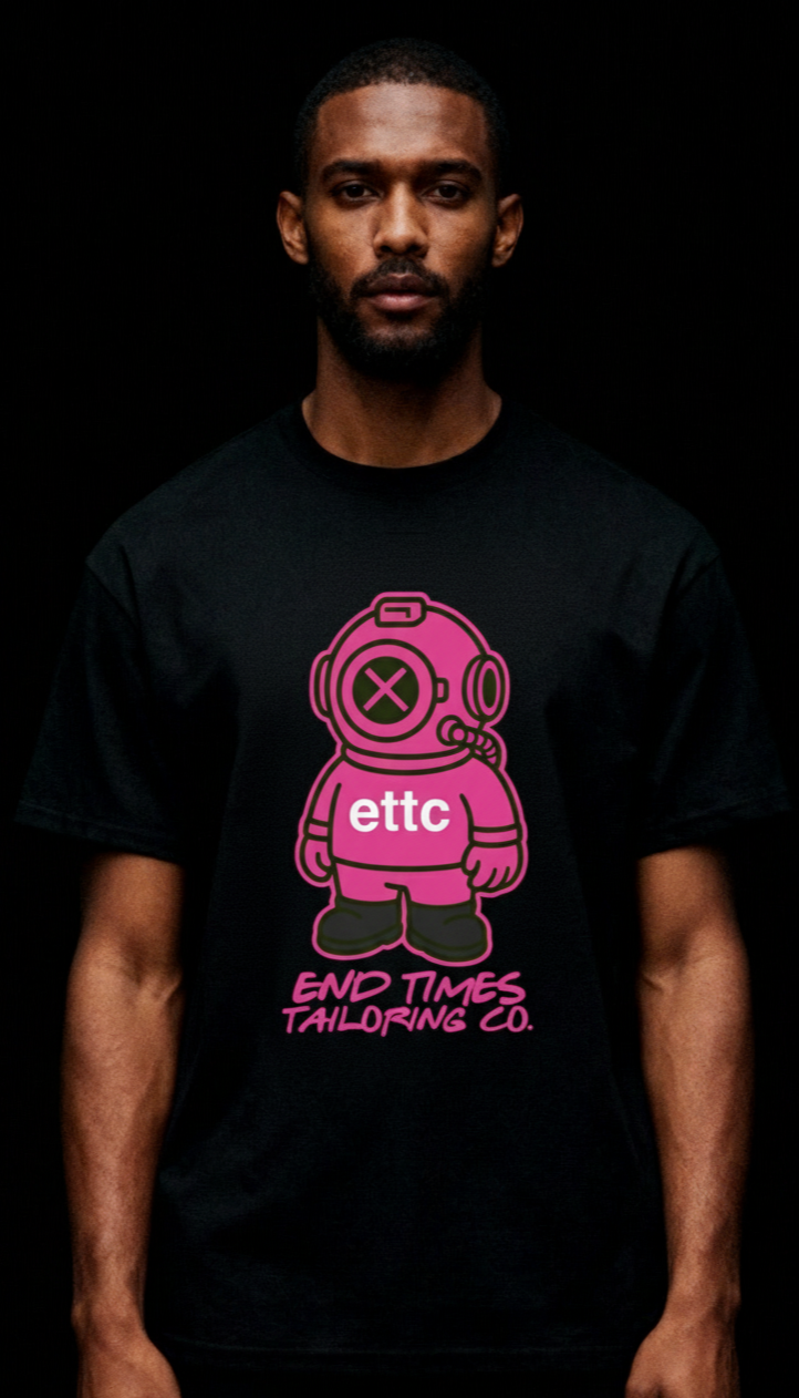 Person wearing a black t-shirt with a pink graphic design and text on a black background